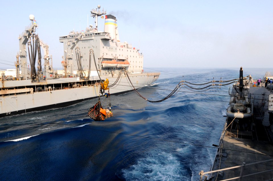 US Navy 110817-N-QL471-392 Pallets of stores are transferred from the Military Sealift Command fleet replenishment oiler USNS Laramie (T-AO 203), l