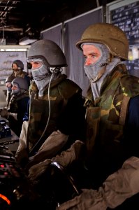 US Navy 110811-N-YM590-011 Sailors man the helm console during a general quarters drill