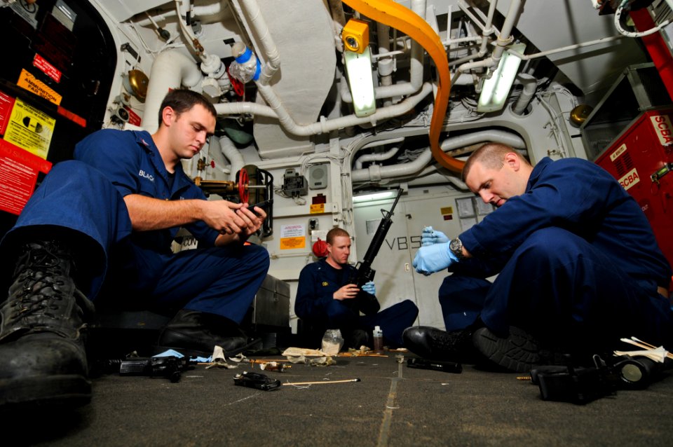US Navy 110815-N-YM590-041 Sailors clean weapons on the USS Anzio