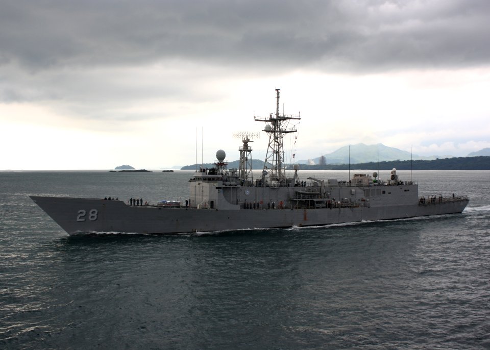 US Navy 110813-N-ZI300-038 Sailors aboard the guided-missile frigate USS Boone (FFG 28) render honors to USS Thach (FFG 43) while departing Panama
