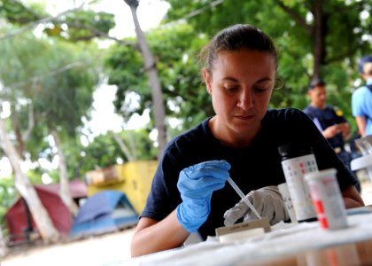 US Navy 110818-F-ET173-295 Hospital Corpsman 2nd Class Raquel Loudermilk, from Seville, Spain, conducts a urinalysis at the Killick Haitian Coast G photo