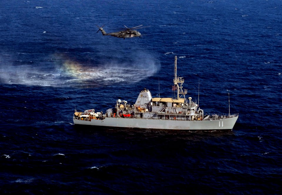 US Navy 110816-N-YX920-162 An SH-60 Sea Hawk helicopter assigned to Helicopter Mine Countermeasures Squadron (HM) 15 flies alongside the mine count