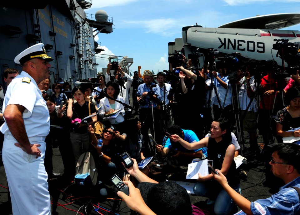US Navy 110812-N-SB672-142 Rear Adm. Robert Girrier, commander of the Ronald Reagan Carrier Strike Group, holds a press conference with Chinese med