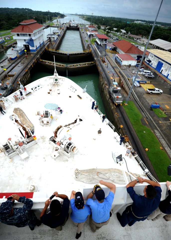 US Navy 110815-N-NY820-276 Service members and civilians aboard the Military Sealift Command hospital ship USNS Comfort (T-AH 20) watch as the ship