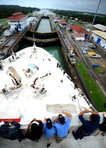 US Navy 110815-N-NY820-276 Service members and civilians aboard the Military Sealift Command hospital ship USNS Comfort (T-AH 20) watch as the ship