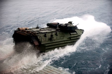 US Navy 110815-N-PB383-004 An amphibious assault vehicle departs the well deck of the San Antonio-class amphibious transport dock ship USS New Orle