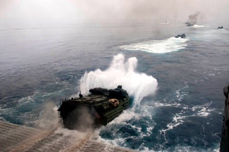 US Navy 110815-N-PB383-003 Amphibious assault vehicles depart the well deck of the San Antonio-class amphibious transport dock ship USS New Orleans