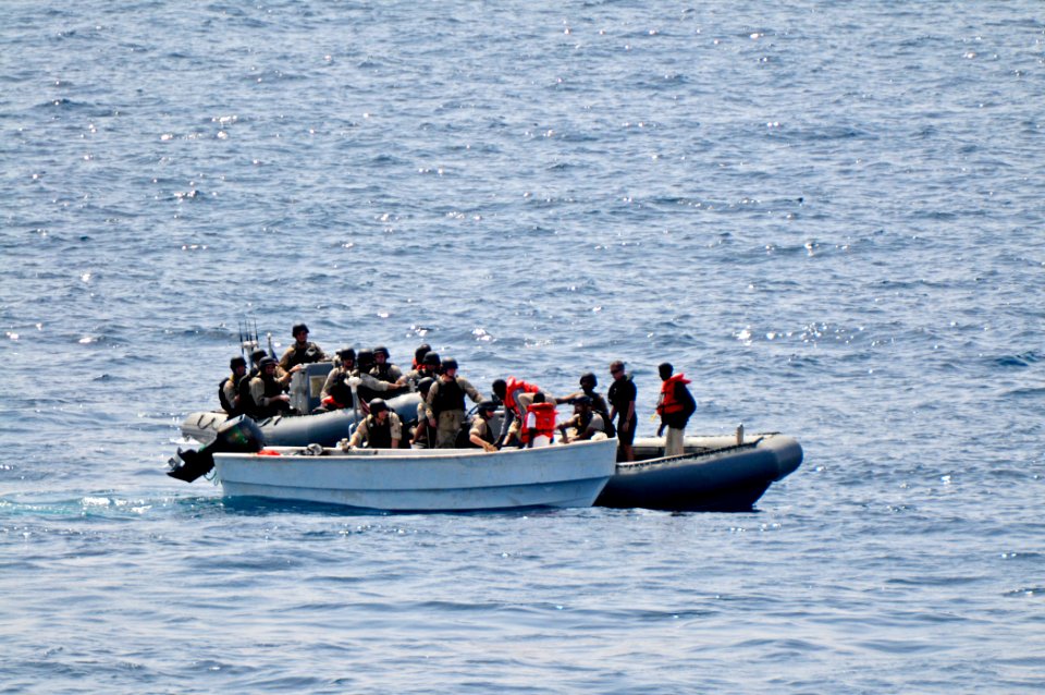 US Navy 110812-N-YM590-104 Members of a visit, board, search and seizure team from the guided-missile cruiser USS Anzio (CG 68) assist mariners abo