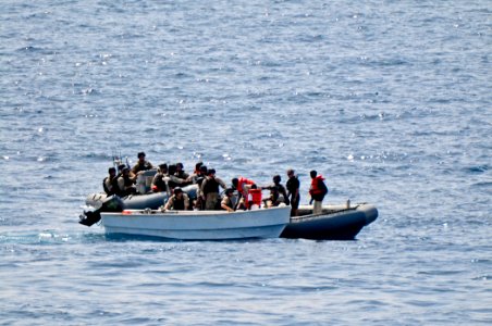 US Navy 110812-N-YM590-104 Members of a visit, board, search and seizure team from the guided-missile cruiser USS Anzio (CG 68) assist mariners abo