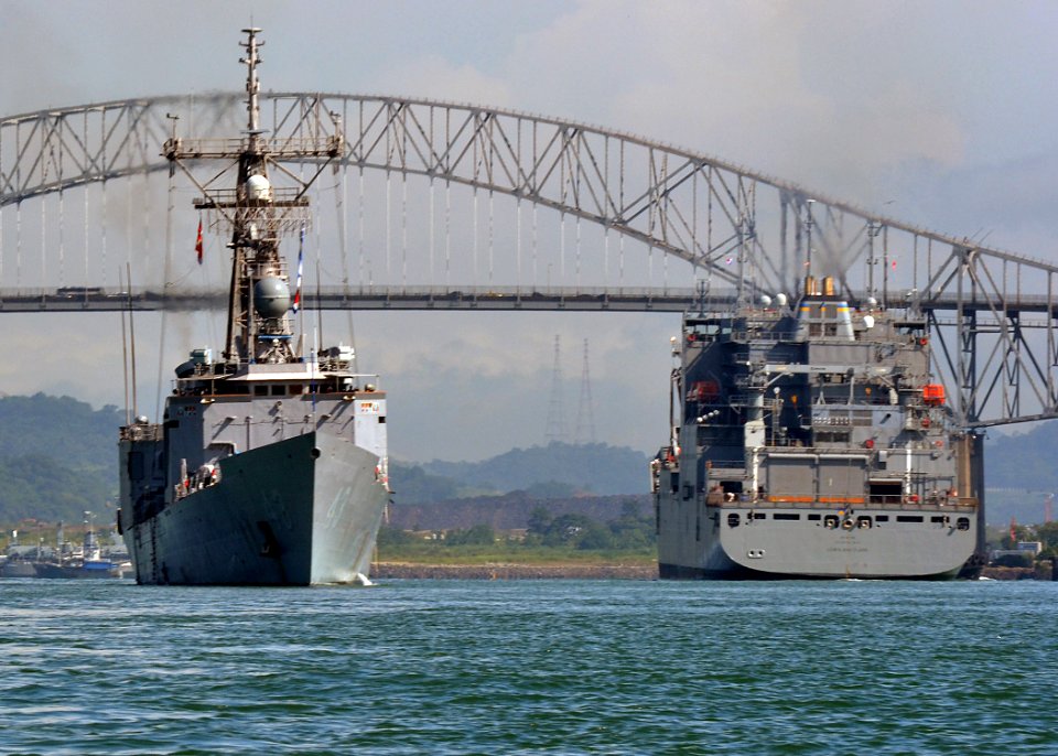 US Navy 110817-N-VA590-159 The guided-missile frigate USS Thach (FFG 43), left, passes alongside the Military Sealift Command dry cargo and ammunit