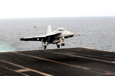 US Navy 110818-N-XE109-002 An F-A-18F Super Hornet assigned to Strike Fighter Squadron (VFA) 213 lands aboard the aircraft carrier USS George H.W