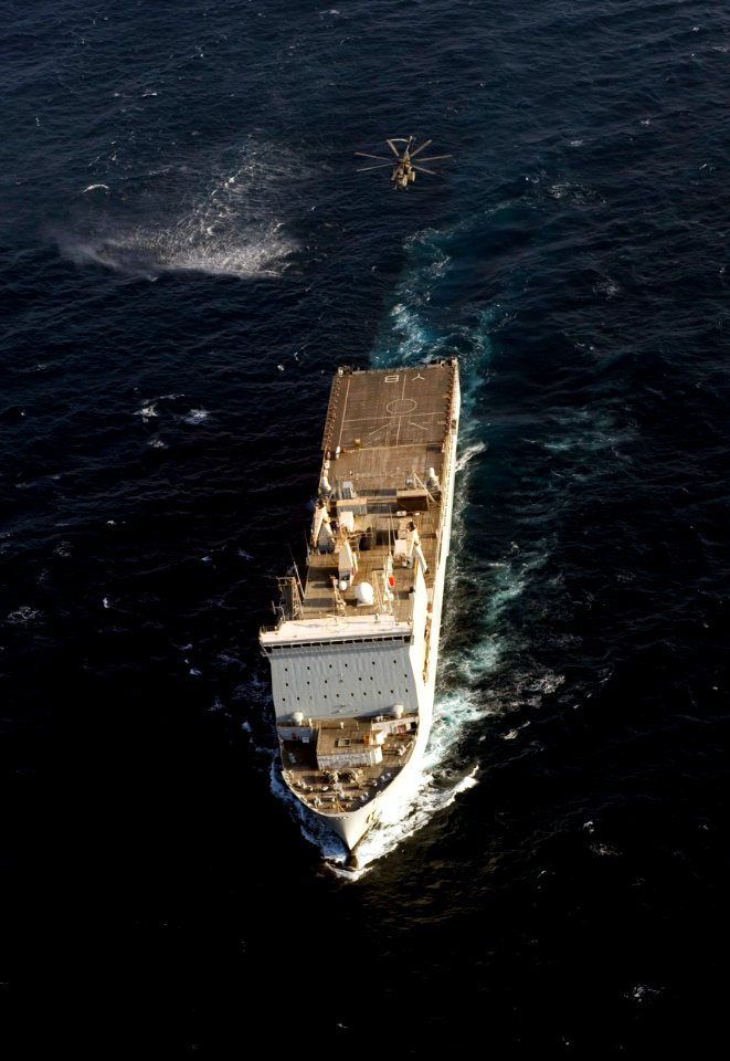 US Navy 110816-N-YX920-599 An SH-60 Sea Hawk helicopter assigned to Navy Helicopter Mine Countermeasures Squadron (HM) 15 approaches the Royal Navy