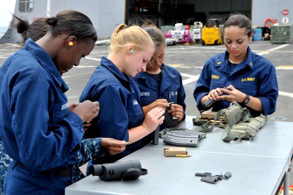 US Navy 110819-N-GW695-447 Sailors load ammunition into magazines