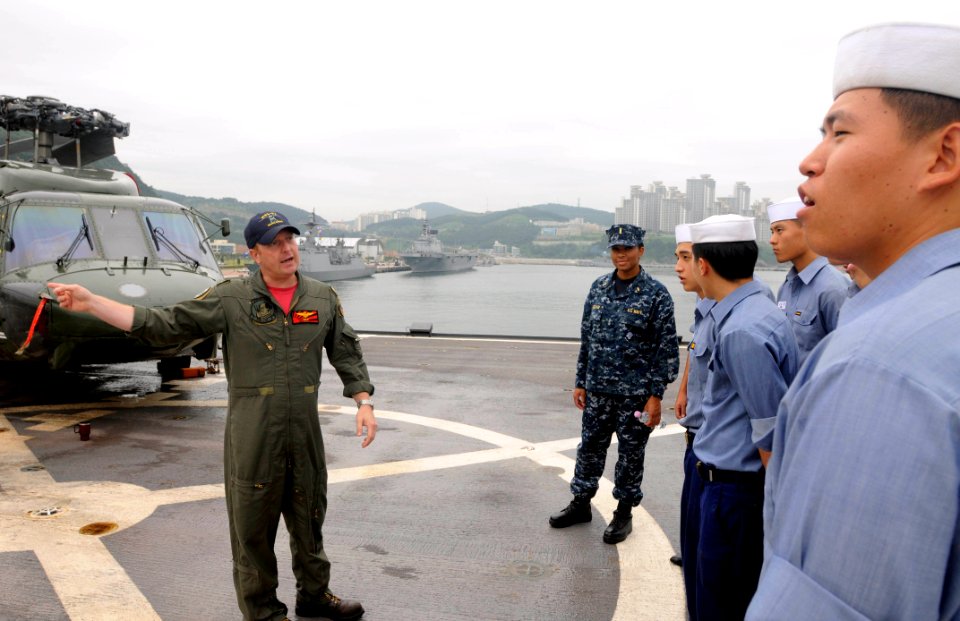 US Navy 110819-N-XG305-207 Lt. Cmdr. Wilson Porter, Air Boss of Light Helicopter Antisubmarine Squadron (HSL) 51, explains the capabilities of an S