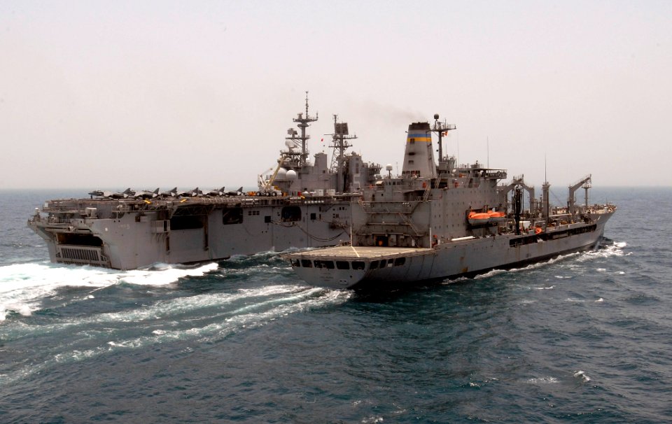 US Navy 110820-N-GH121-035 The amphibious assault ship USS Bataan (LHD 5), left, conducts an underway replenishment
