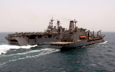 US Navy 110820-N-GH121-035 The amphibious assault ship USS Bataan (LHD 5), left, conducts an underway replenishment