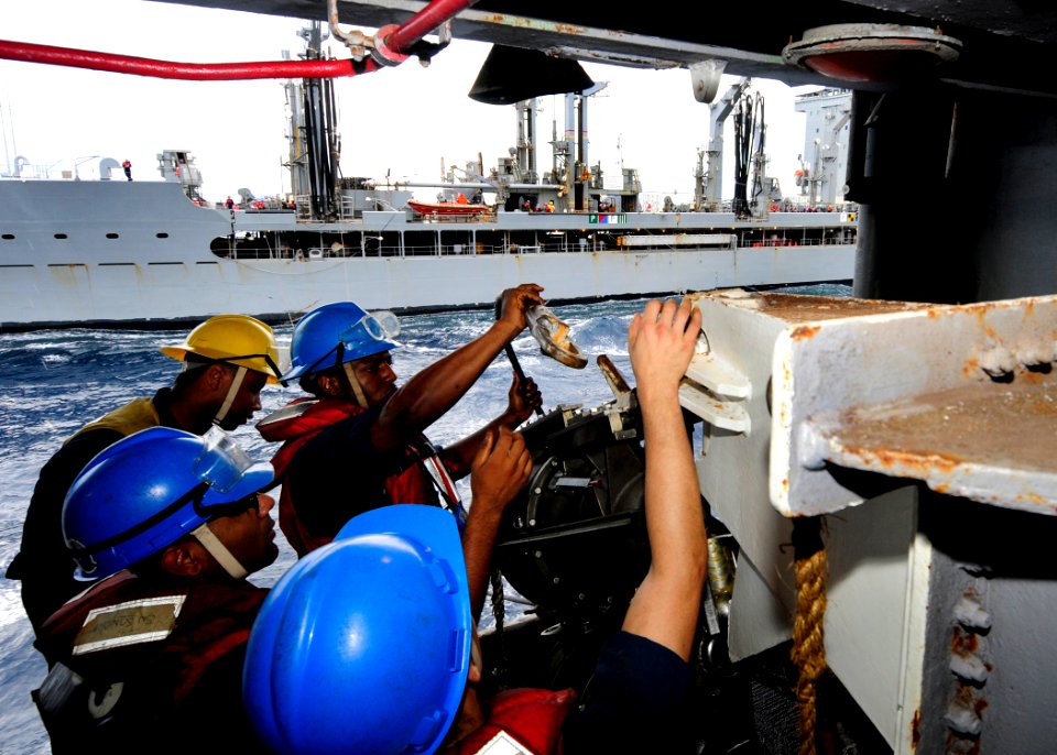 US Navy 110815-N-JO245-028 Sailors assigned to the deck department of the aircraft carrier USS George Washington (CVN 73) place a steel span wire o