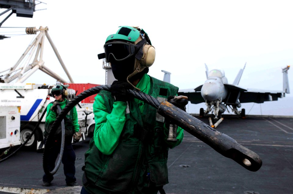 US Navy 110815-N-XE109-545 Aviation Boatswain's Mate (Equipment) Airman Megan E. Walker, left, and Aviation Boatswain's Mate Airman Kapri D. Ragin
