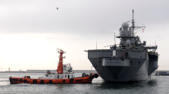 US Navy 110818-N-XG305-253 The USS Blue Ridge (LCC 19) is assisted by a tugboat as the ship moors in Busan, Republic of Korea