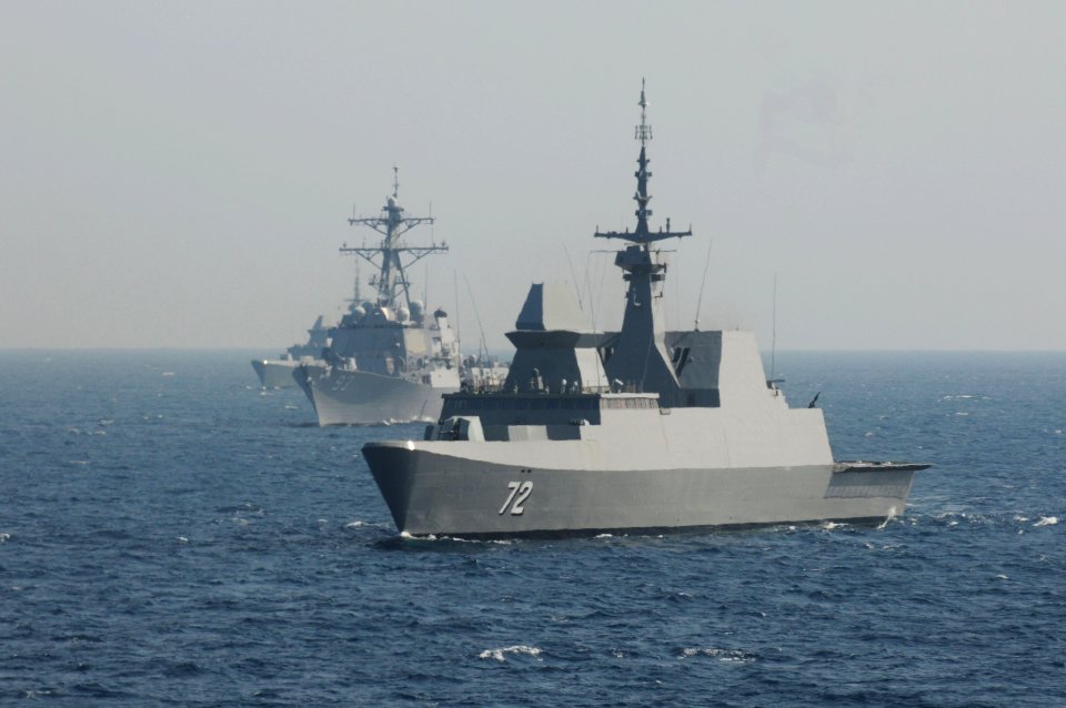 US Navy 110822-N-IO627-018 The guided-missile destroyer USS Chung-Hoon (DDG 93), center, turns in formation with the Republic of Singapore navy For