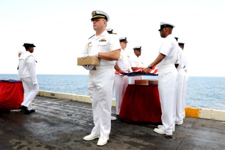 US Navy 110818-N-AU622-036 Lt. Jonathan Cochran and chief petty officers of the flag detail prepare to release cremains to the deep during a burial photo