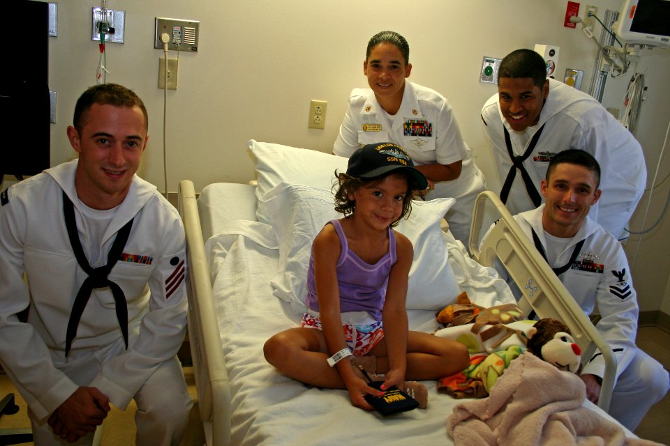 US Navy 110815-N-ZL585-140 Sailors assigned to the guided-missile destroyer USS Shoup (DDG 86) visit a patient during a