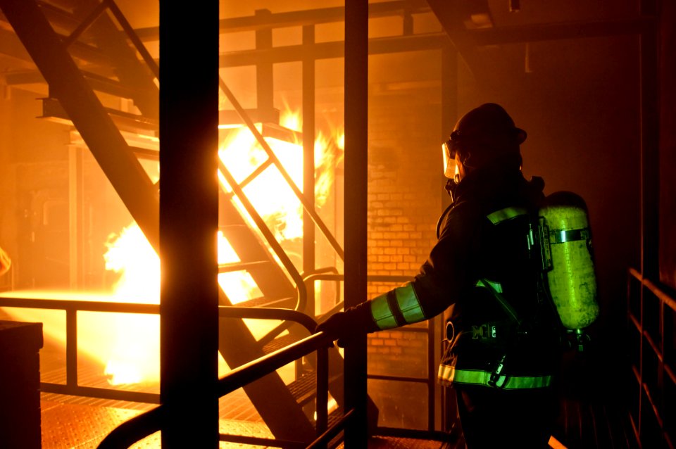 US Navy 110818-N-ER662-149 Chief Damage Controlman (Select) Robert Lyons observes a simulated fire during training