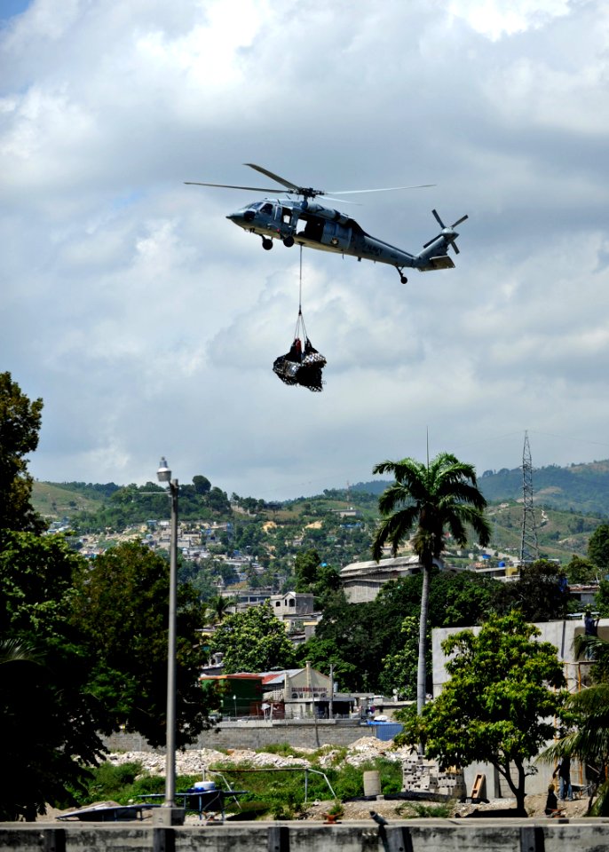 US Navy 110818-N-NY820-101 An MH-60S Sea Hawk helicopter assigned to the Chargers of Helicopter Sea Combat Squadron (HSC) 26, transports cargo to a