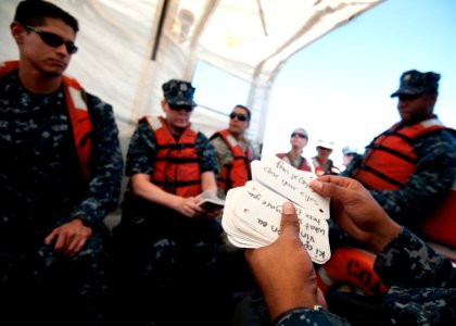 US Navy 110818-N-NY820-085 A Sailor embarked aboard the Military Sealift Command hospital ship USNS Comfort (T-AH 20) shuffles through French-Creol photo