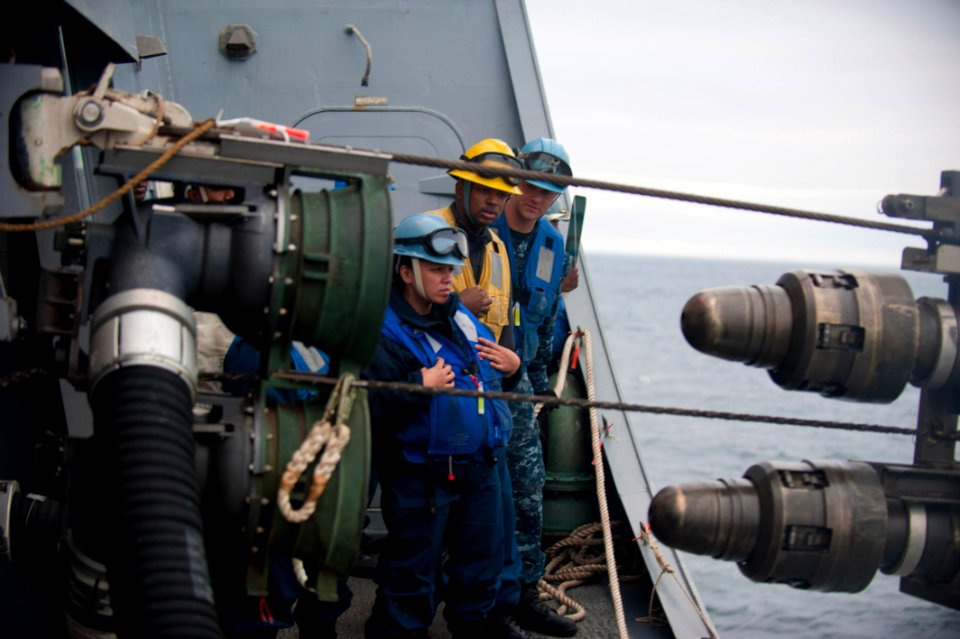 US Navy 110821-N-PB383-404 The USS New Orleans connects fuel lines during a replenishment at sea
