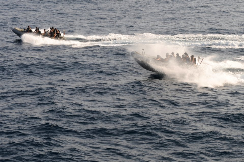 US Navy 110819-N-DU438-593 Members of the visit, board, search and seizure team assigned to the guided-missile cruiser USS Gettysburg (CG 64) maneu