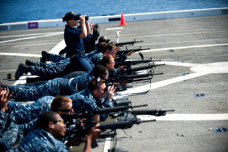 US Navy 110817-N-PB383-010 Sailors take aim at their targets during M16 service rifle qualifications aboard the San Antonio-class amphibious transp