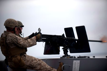 US Navy 110817-N-PB383-003 A Marine assigned to the 11th Marine Expeditionary Unit (11th MEU) fires a .50-caliber machine gun aboard the San Antoni