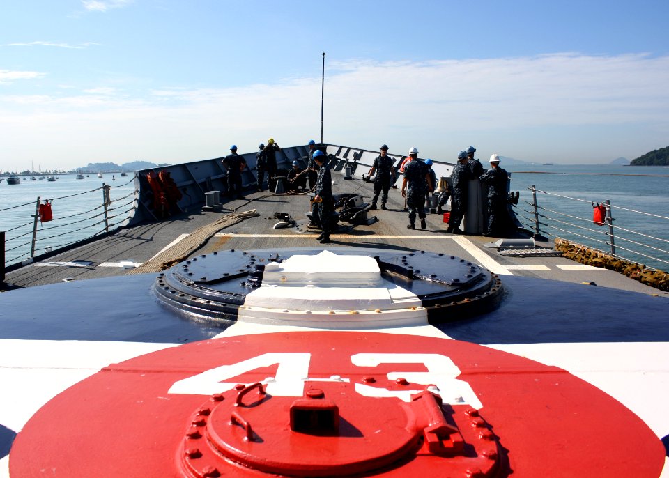 US Navy 110817-N-ZI300-023 he sea and anchor detail aboard the USS Thach man the foc'sle