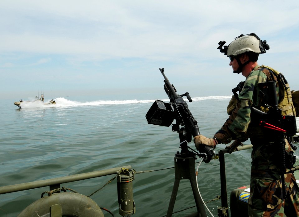 US Navy 110818-N-YO394-219 Sailors from RIVRON 1 observes high speed maneuvers by a command boat