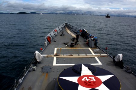US Navy 110825-N-ZI300-002 Sailors aboard the guided-missile frigate USS Thach (FFG 43) prepare to arrive in Panama City, Panama for the close of P photo