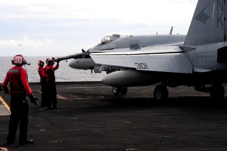 US Navy 110824-N-UO379-489 Aviation Ordnancemen disarm an AIM-9 Sidewinder missile attached to an F-A-18C Hornet assigned to the Blue Diamonds