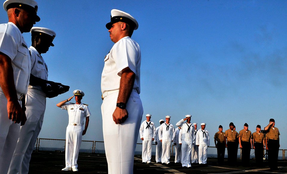 US Navy 110822-N-AG285-386 Capt. Eric Conzen, commanding officer of the amphibious dock landing ship USS Whidbey Island (LSD 41), left center
