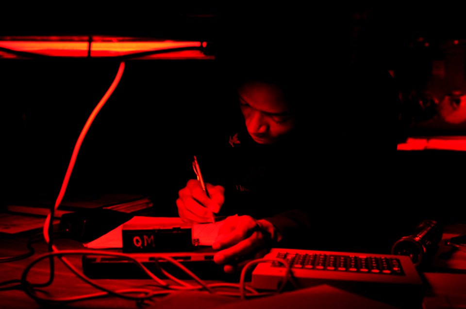US Navy 110826-N-DU438-059 Quartermaster 3rd Class Lonnie Williams writes in the ship's deck log during a watch on the bridge aboard the guided-mis