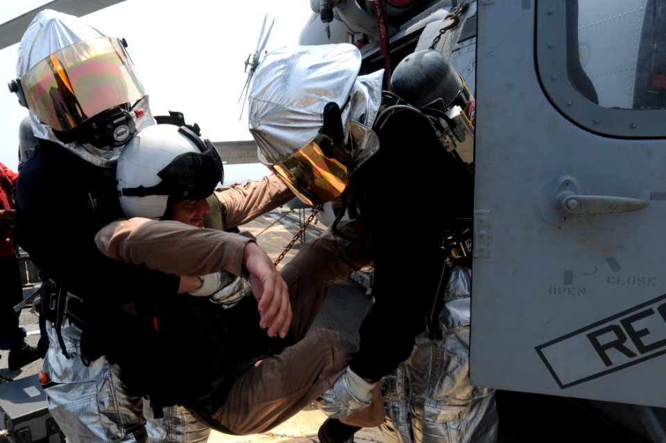 US Navy 110818-N-QL471-392 Sailors simulate rescuing a pilot