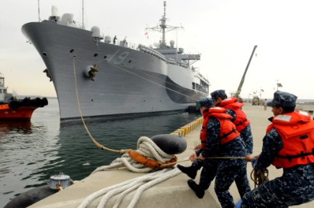 US Navy 110818-N-XG305-252 Sailors cast-off a mooring line