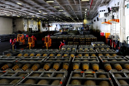 US Navy 110827-N-UO379-036 Sailors assigned to the weapons department aboard the aircraft carrier USS Ronald Reagan (CVN 76) organize high explosiv
