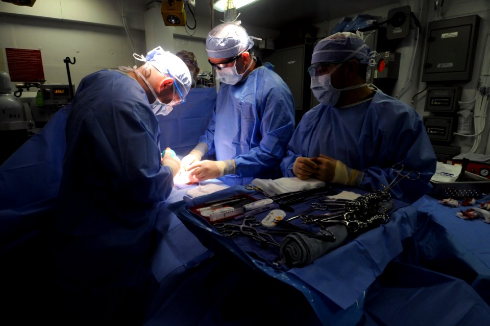 US Navy 110824-N-JD217-053 Doctors on the USS George Bush conduct surgery