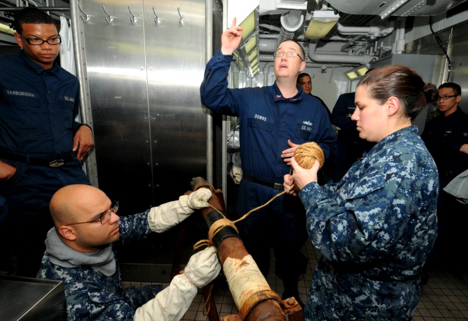 US Navy 110823-N-SF704-050 Sailors wrap a leaky pipe during a general quarters drill