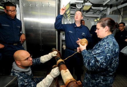 US Navy 110823-N-SF704-050 Sailors wrap a leaky pipe during a general quarters drill
