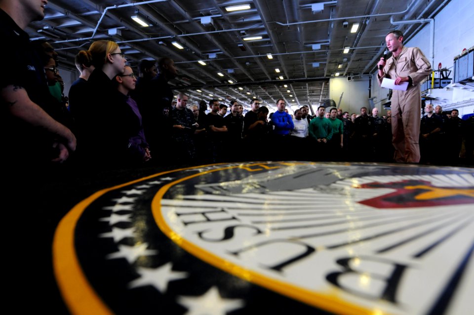 US Navy 110824-N-XE109-016 Rear Adm. Ted Branch addresses the crew of USS George H.W. Bush (CVN 77) during an all-hands call aboard the ship