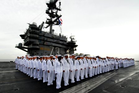 US Navy 110825-N-AW206-010 Sailors aboard USS George Washington (CVN 73) stand ready to man the rails as the ship returns to Fleet Activities Yokos