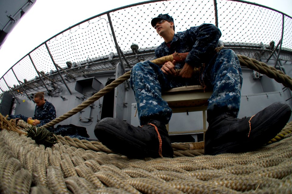 US Navy 110830-N-ZC343-550 Sailors perform maintenance on mooring lines aboard USS Bonhomme Richard (LHD 6).