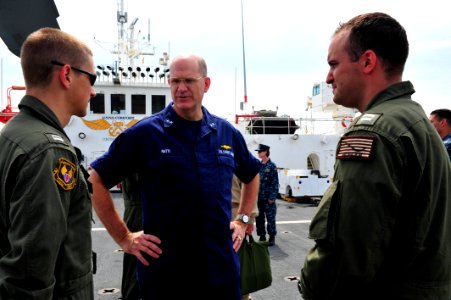 US Navy 110828-F-NJ219-063 Rear Adm. Steven Ratti talks to pilots assigned to Helicopter Sea Combat Squadron (HSC) 26 about their experiences aboar photo