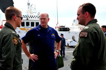 US Navy 110828-F-NJ219-063 Rear Adm. Steven Ratti talks to pilots assigned to Helicopter Sea Combat Squadron (HSC) 26 about their experiences aboar
